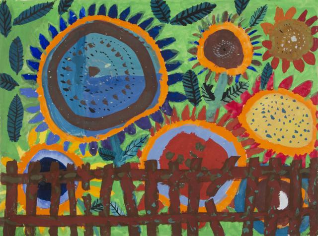 Blumen hinterm Gartenzaun